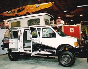 The Ultimate Adventure vehicle with doors open on display at the Los Angeles Auto Show.
