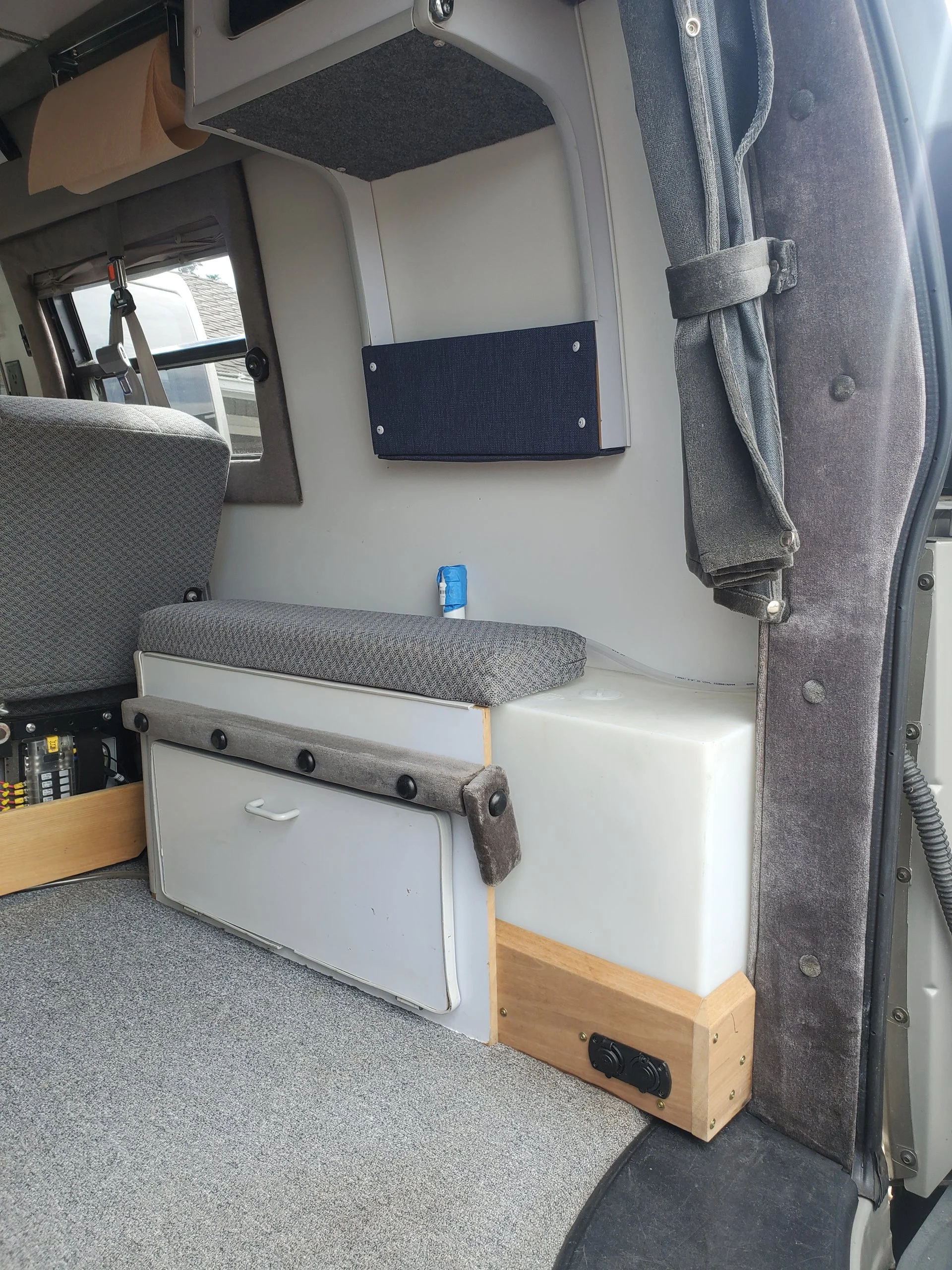 2001 Chevy Express 2500 EB50 Penthouse Top, interior bench and side storage by the rear doors