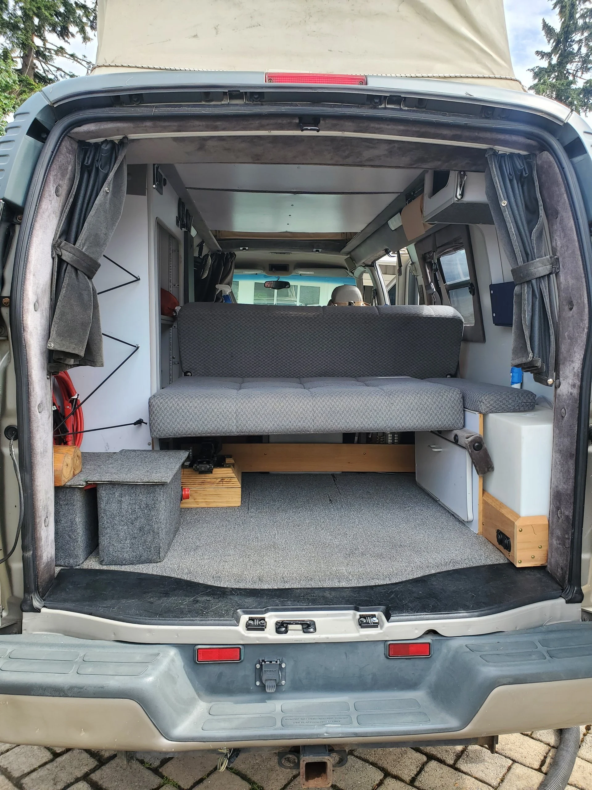 2001 Chevy Express 2500 EB50 Penthouse Top, rear doors open, rear sofa and interior