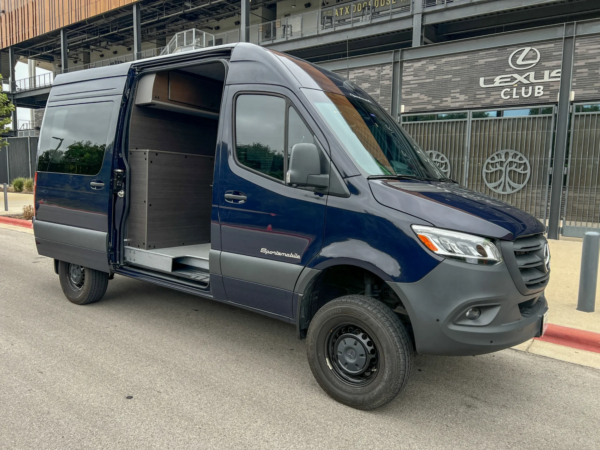 Mercedes Sprinter 2500 144 High Roof AWD Motorcycle Hauler and Front Sitting Area, exterior, sliding door open to the sitting area