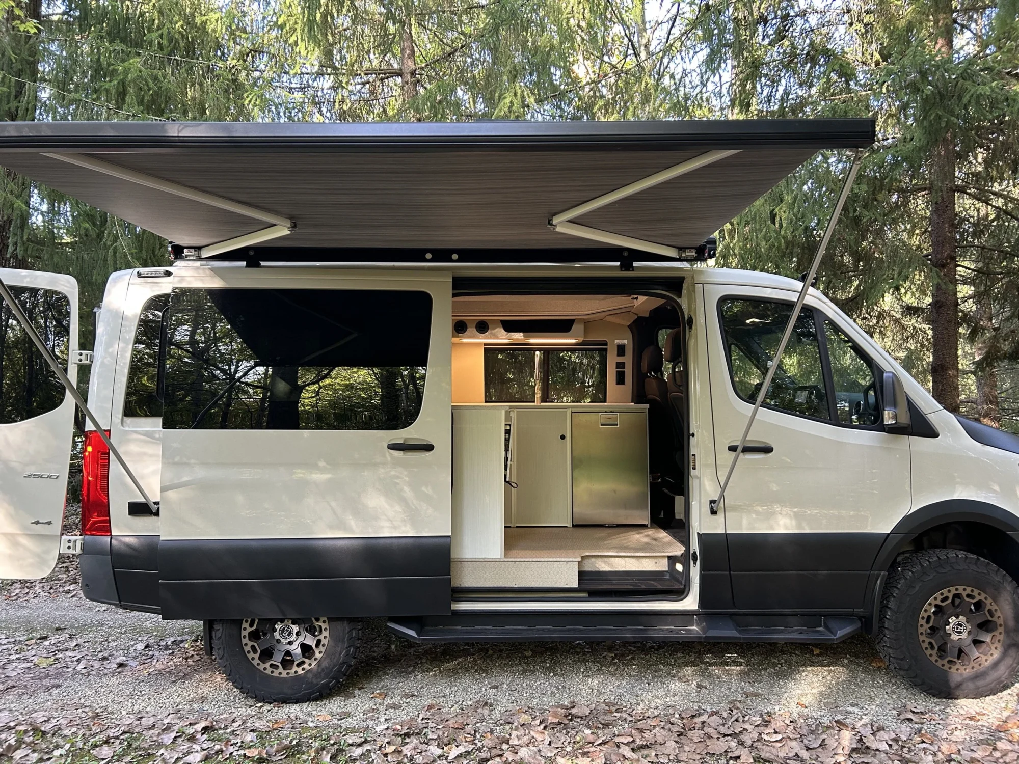 New 2022 Sprinter 2500 144 4x4 RB-150S, passenger side, sliding door open, awning out