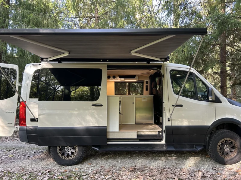 New 2022 Sprinter 2500 144 4x4 RB-150S, passenger side, sliding door open, awning out