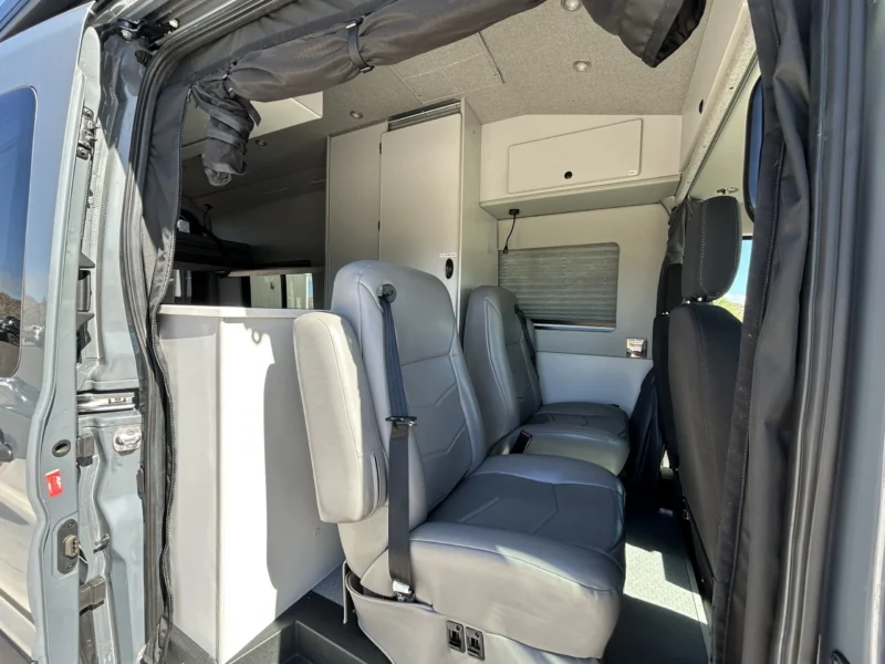 2024 Ford Transit 350 148 High Roof AWD, sliding door entry and second-row grey captain's chairs