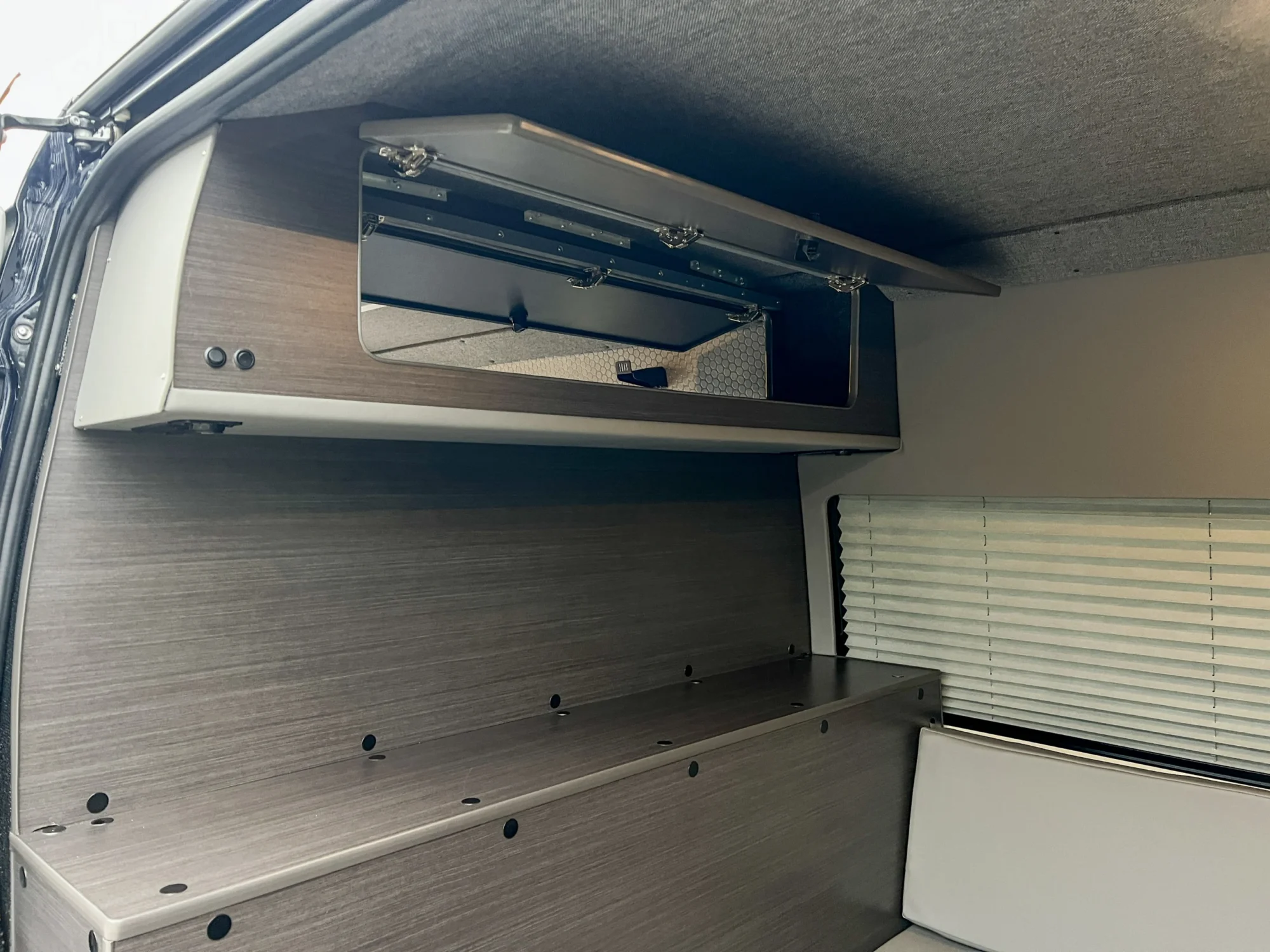 Mercedes Sprinter 2500 144 High Roof AWD Motorcycle Hauler and Front Sitting Area, partition wall shelf and ottoman storage