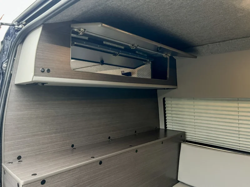Mercedes Sprinter 2500 144 High Roof AWD Motorcycle Hauler and Front Sitting Area, partition wall shelf and ottoman storage