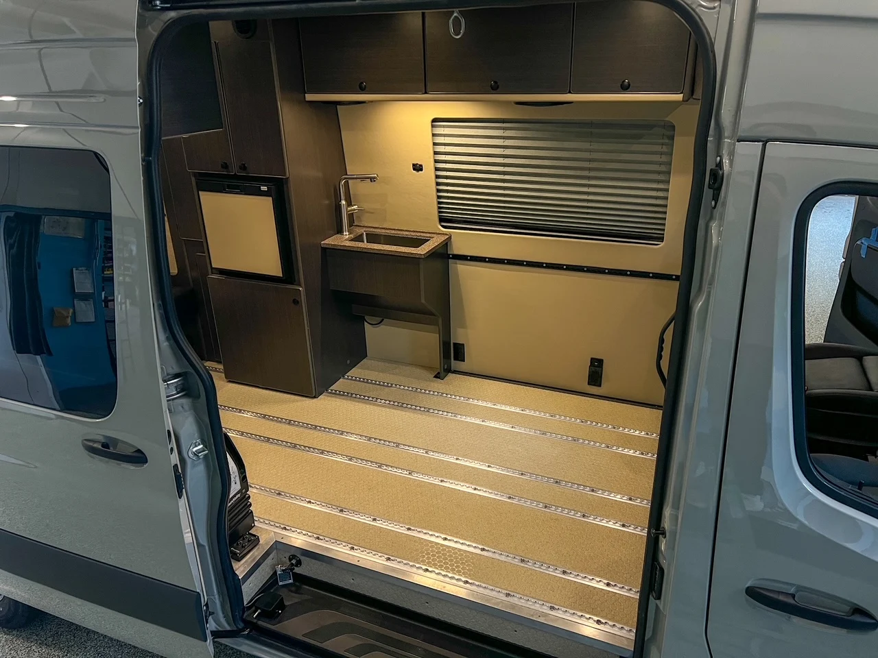 2026 Mercedes Sprinter 170 High Roof AWD Wheelchair Accessible, sliding door open, track floor and sink cabinet