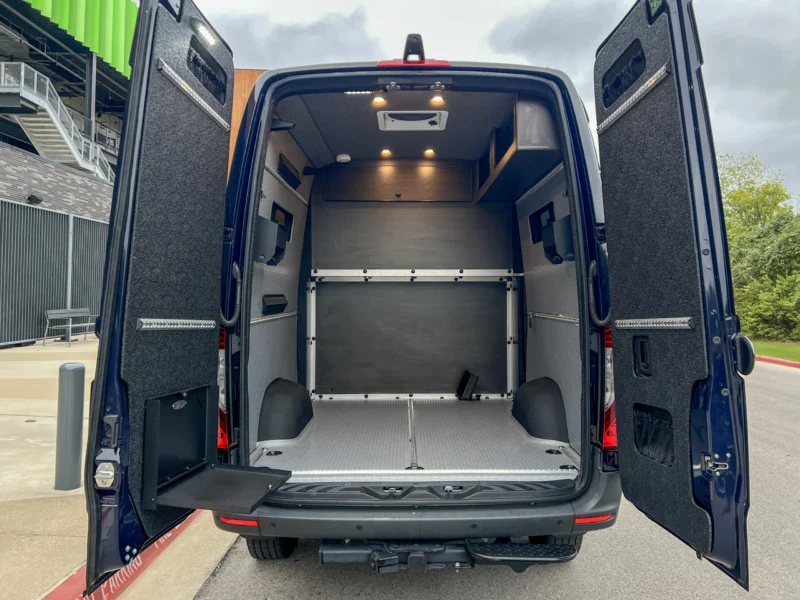 Mercedes Sprinter 2500 144 High Roof AWD Motorcycle Hauler and Front Sitting Area, rear doors open to the garage