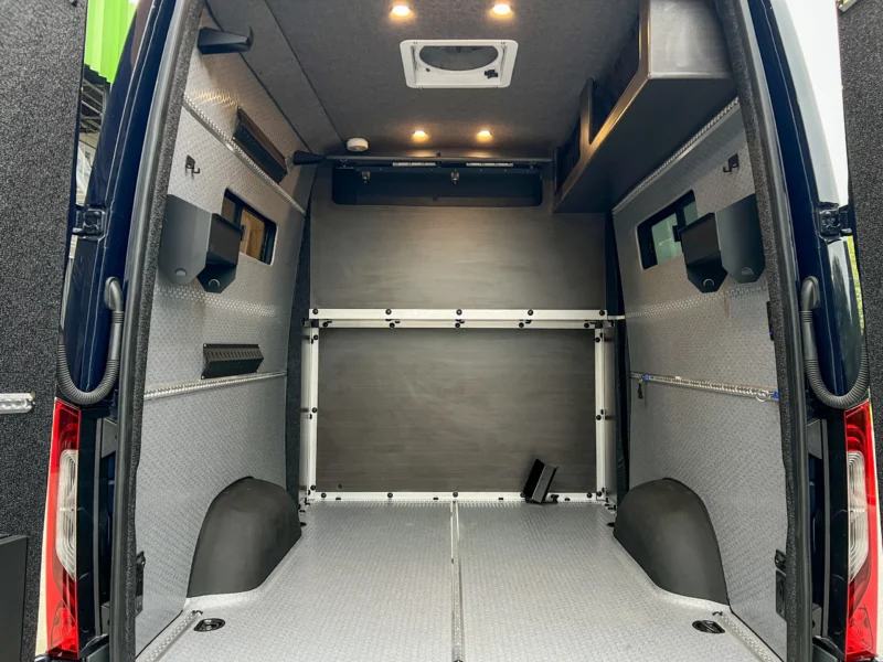 Mercedes Sprinter 2500 144 High Roof AWD Motorcycle Hauler and Front Sitting Area, garage looking forward to the partition wall