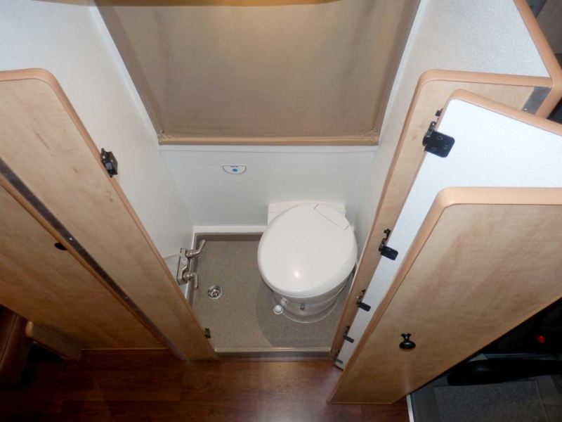 Transit camper conversion interior toilet.