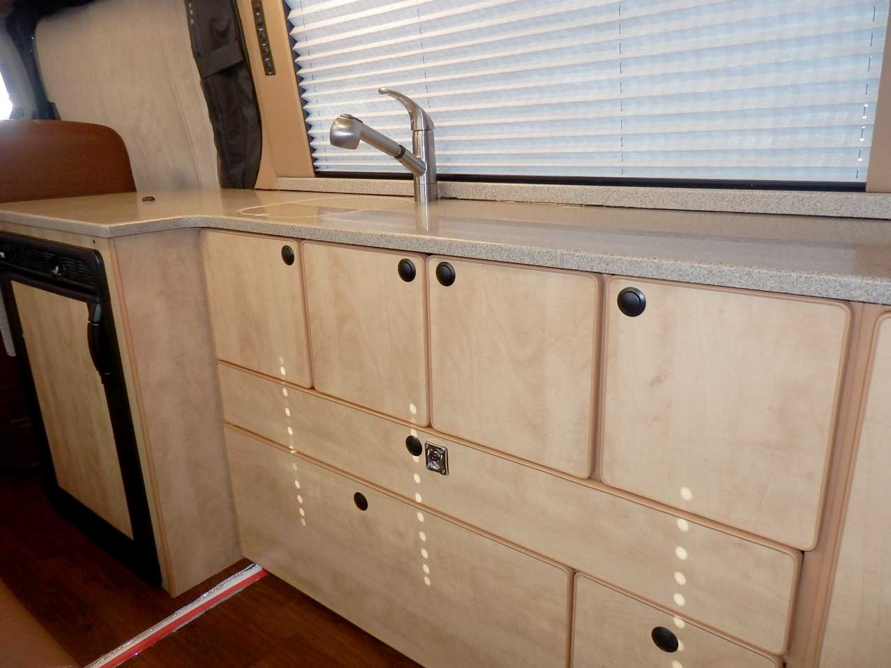 Transit camper conversion interior cabinets.