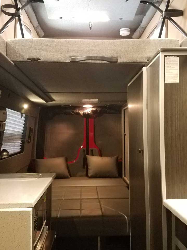 Custom Red RB-50M Sportsmobile Sprinter with leather couch.