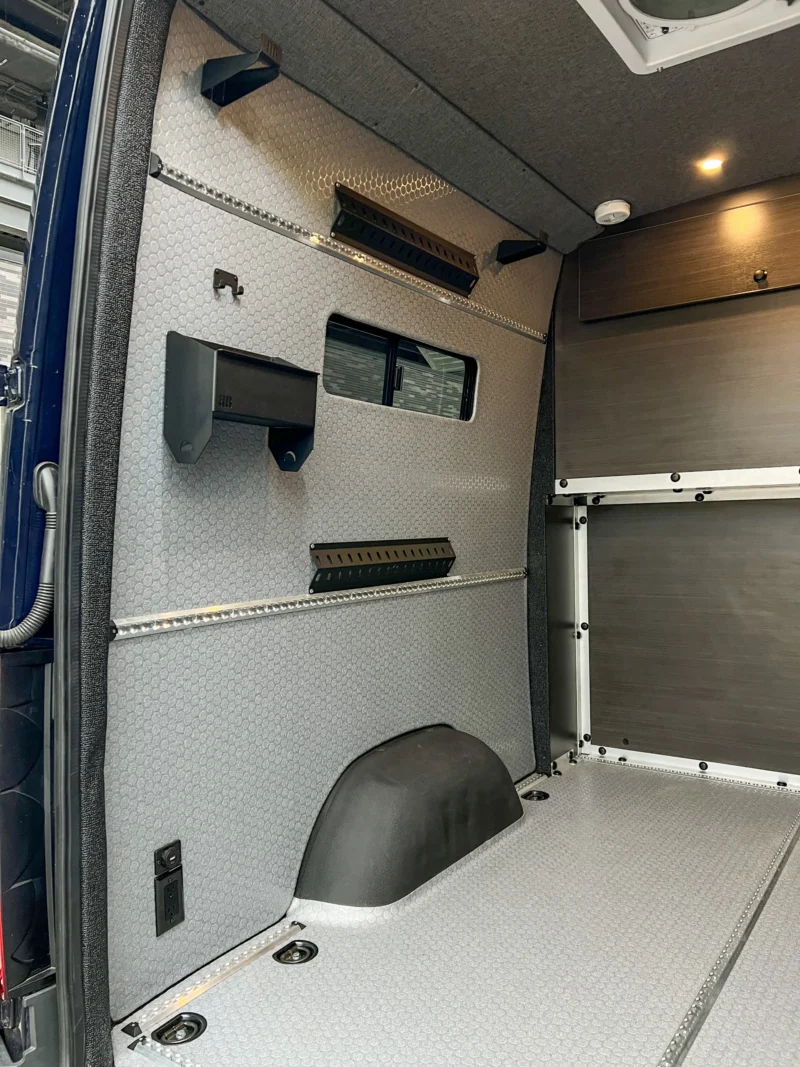 Mercedes Sprinter 2500 144 High Roof AWD Motorcycle Hauler and Front Sitting Area, garage wall with L Track, driver side