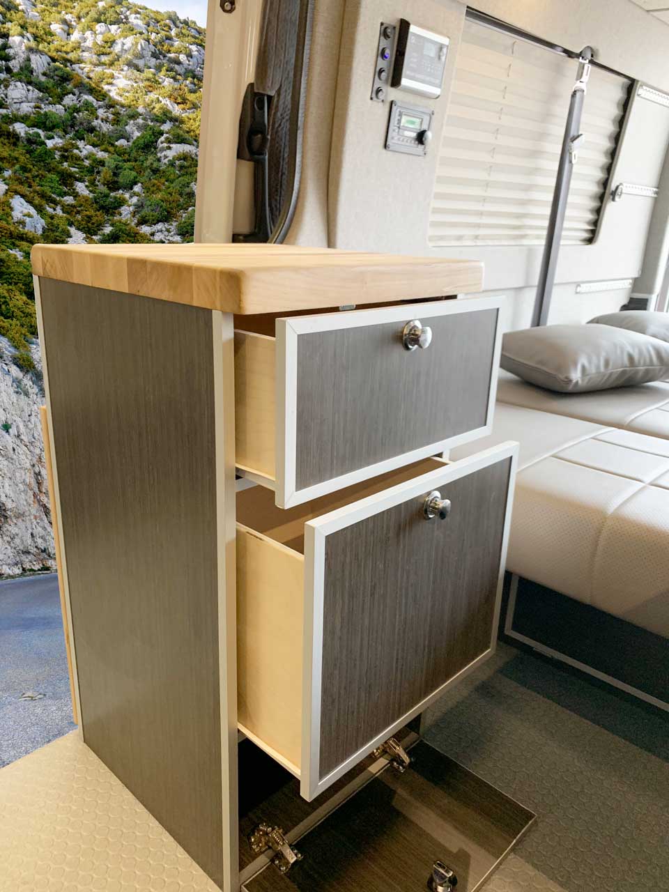 Upgraded cabinets with aluminum edging.