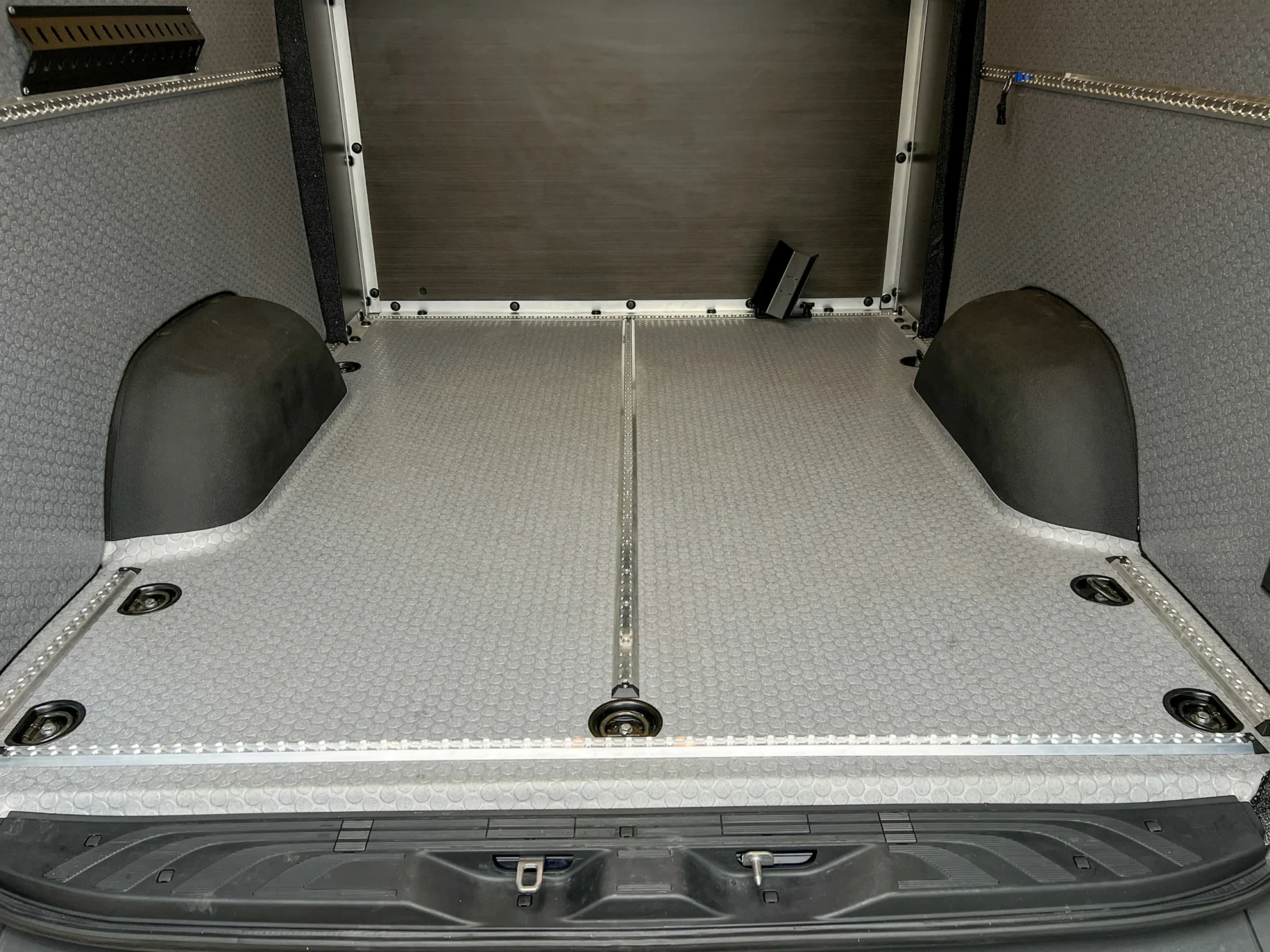 Mercedes Sprinter 2500 144 High Roof AWD Motorcycle Hauler and Front Sitting Area, garage floor with L Track