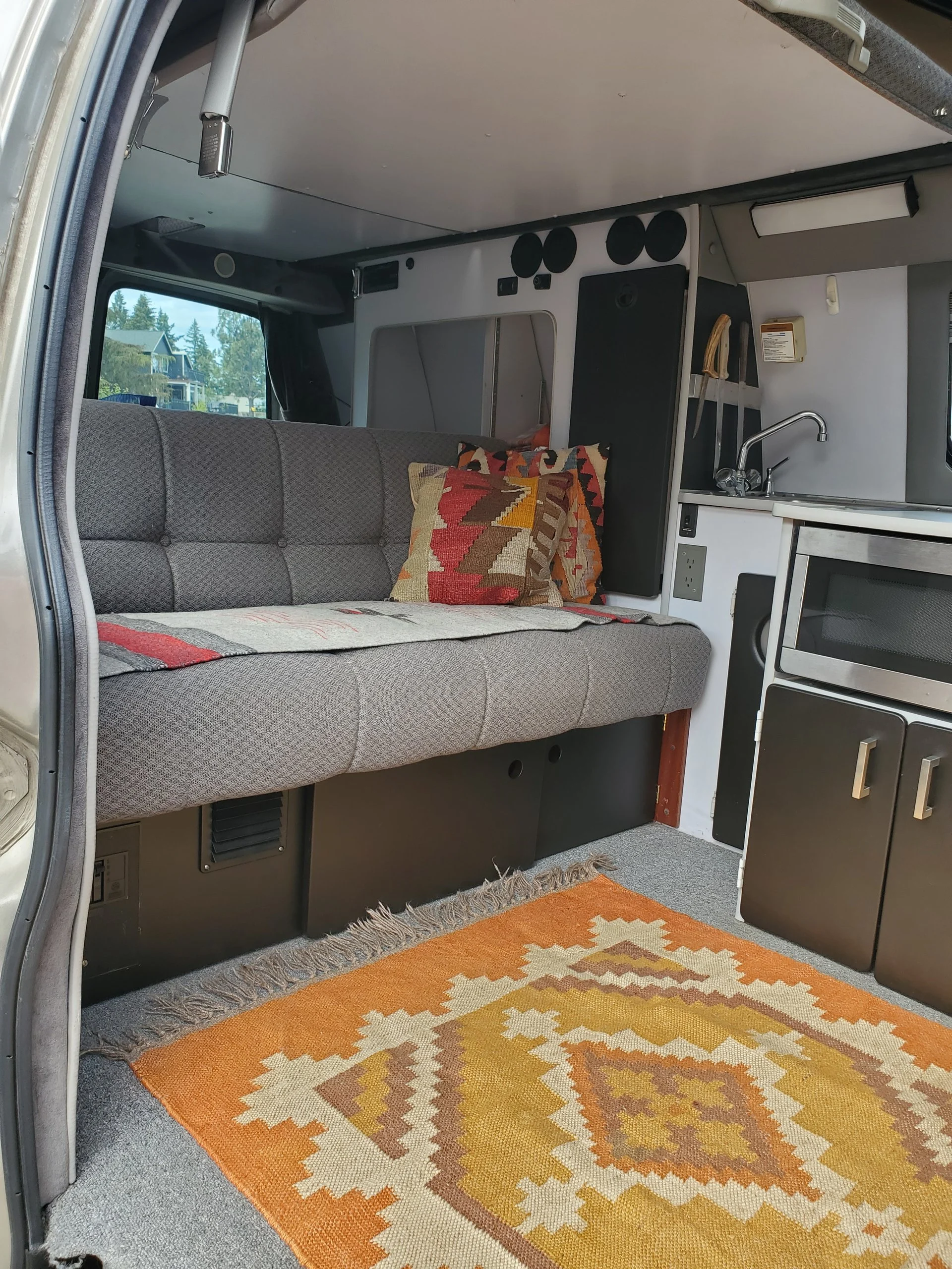 2001 Chevy Express 2500 EB50 Penthouse Top, interior with rear sofa and galley