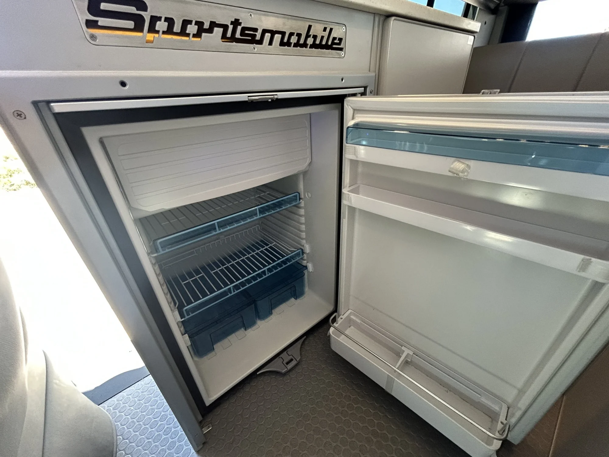 2024 Ford Transit 350 148 High Roof AWD, Dometic CRX-110S 12V compressor fridge with door open