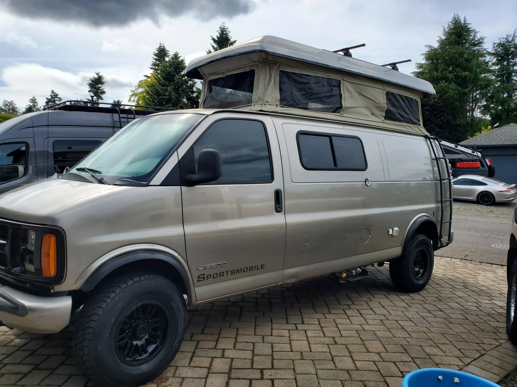 2001 Chevy Express 2500 EB50 Penthouse Top, front three-quarter, driver side, top up