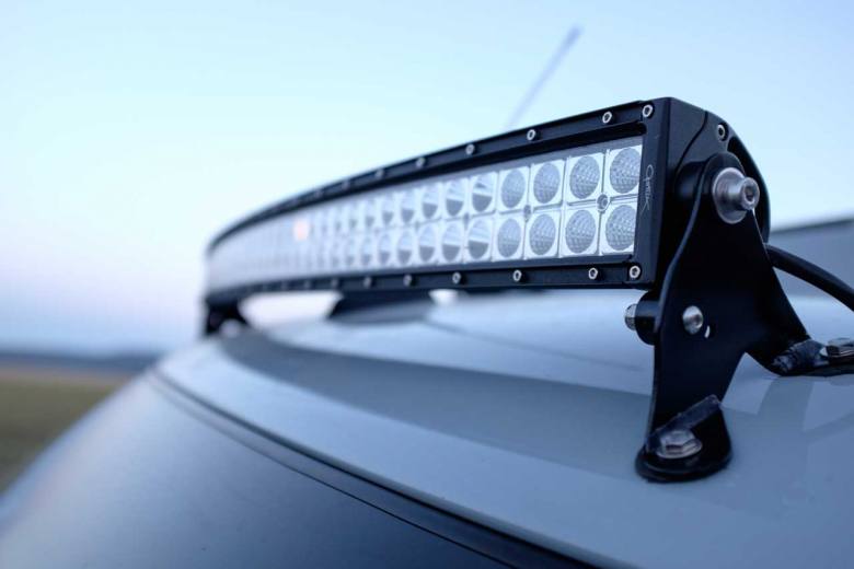 A custom Sportsmobile Sprinter 4x4 camper van conversion featuring an LED light bar.