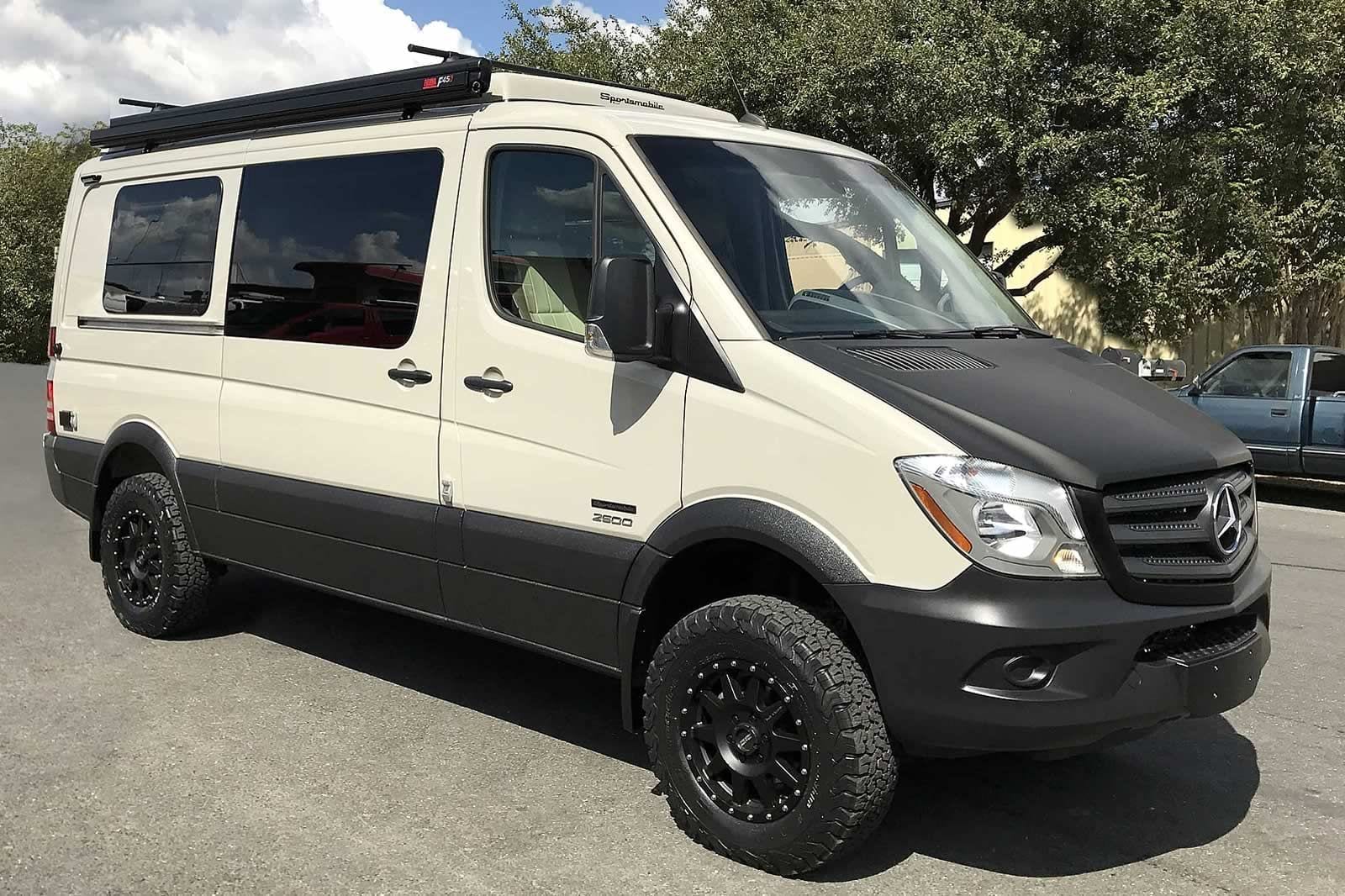 A custom Sportsmobile conversion van with an upgraded exterior rocker panel coating.