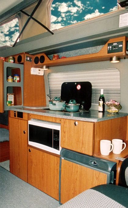 Interior view of the galley inside of camper van.