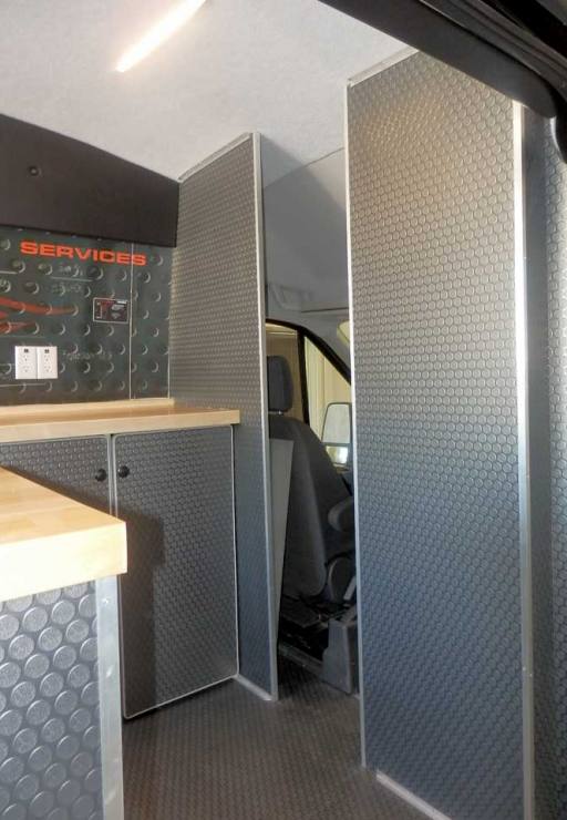 Sportsmobile's field service van with stainless steel finish out.