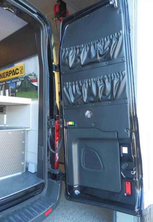 Sportsmobile's field service van with tool carrier on rear door.