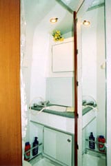 Interior view of a sink inside a Sportsmobile conversion van.