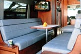 Interior view of a dinette with optional bolsters in a Sportsmobile van conversion.