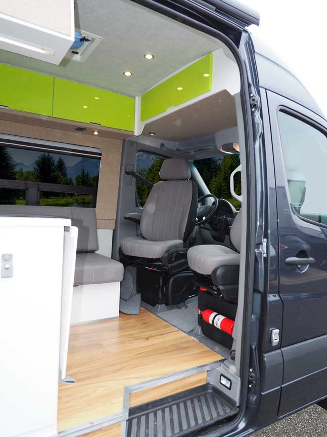 View of the interior custom options, such as wood floors, in a Sportsmobile conversion van.