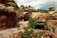 Red and yellow Sportsmobile conversion having fun in the Moab.