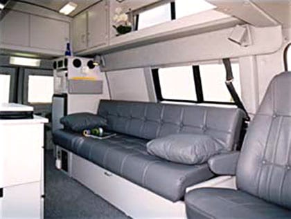View of the Full-length side shelves are standard on a custom Sportsmobile van conversion.