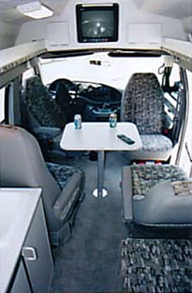 View of the overhead front compartment of a custom Sportsmobile van conversion.