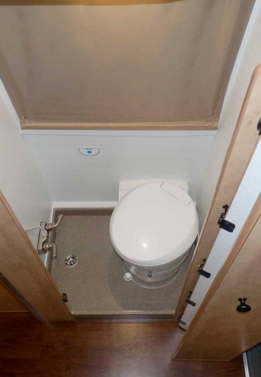 Transit camper conversion interior toilet.