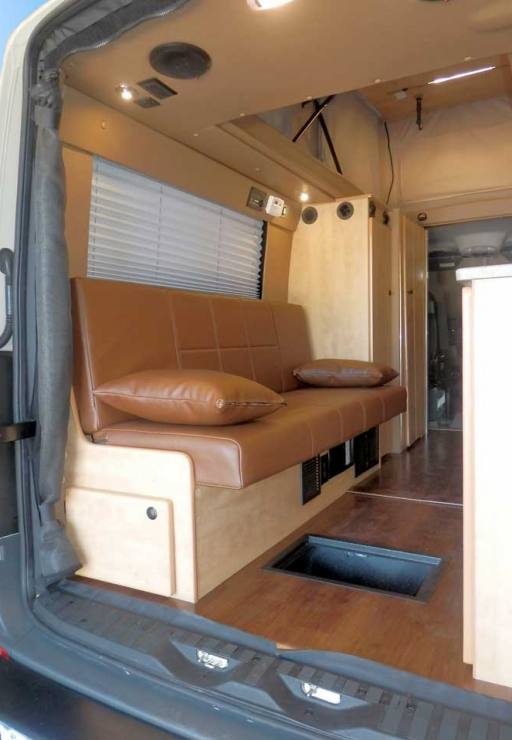 Transit camper conversion interior view of storage space under the gaucho.