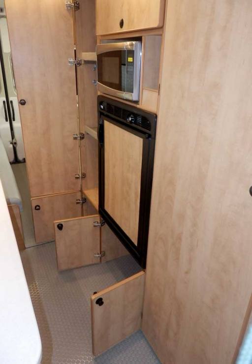 Ford Transit camper conversion with extra large cabinets.