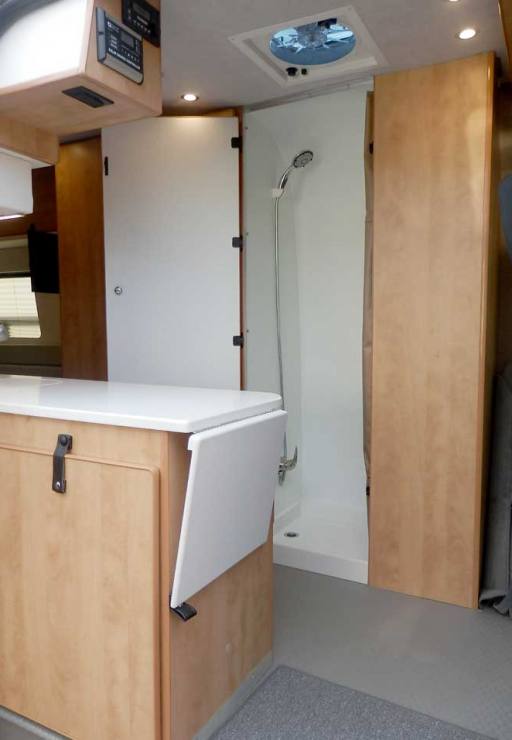 Ford Transit camper conversion featuring easy to clean laminate walls.
