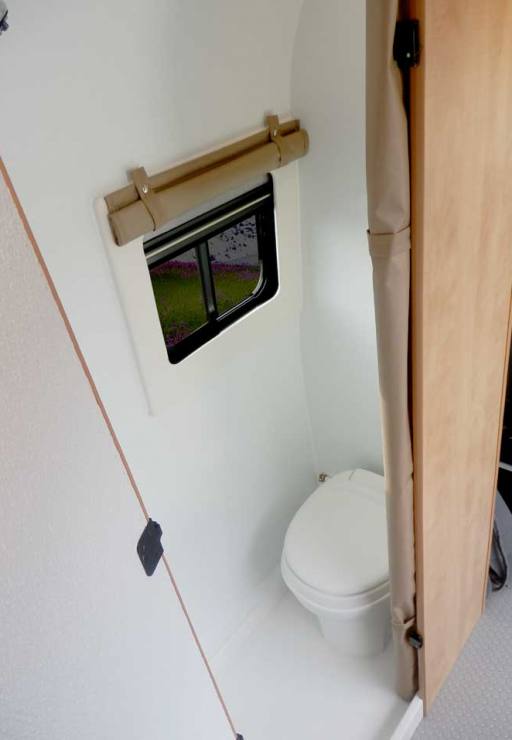 Ford Transit camper conversion with indoor toilet.