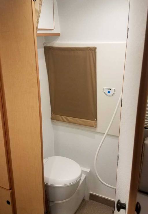 The bath and includes a cassette toilet. An attic fan provides ventilation.