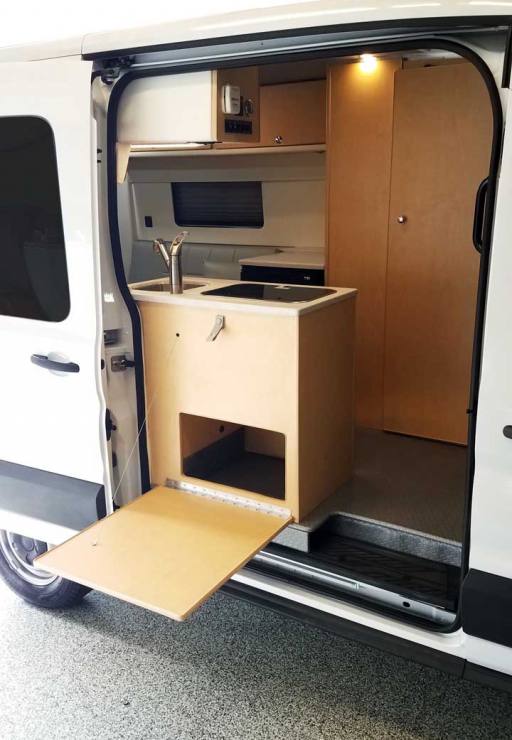 Exterior view of Transit conversion van with dropdown table extended.