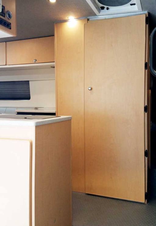 View of Transit conversion van featuring a bath compartment.