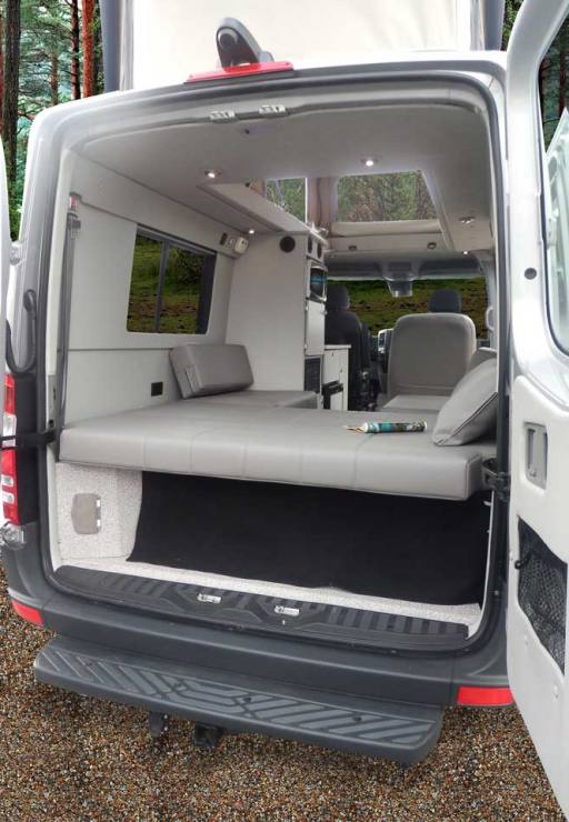 Custom Mercedes-Benz conversion van with shower and power in the rear.