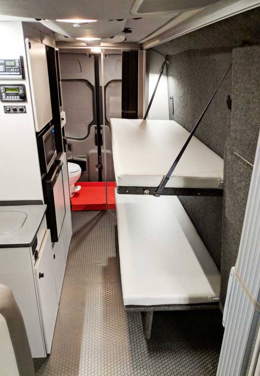 Bunks extended for sleeping or for use as storage.