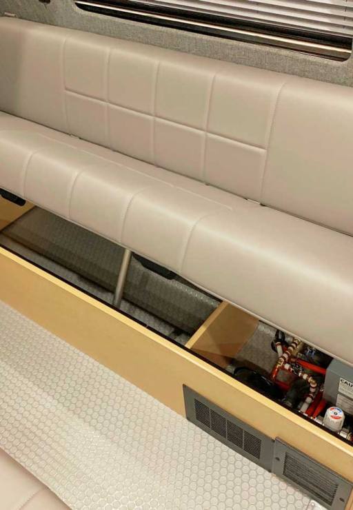 Dinette features storage space underneath seats.