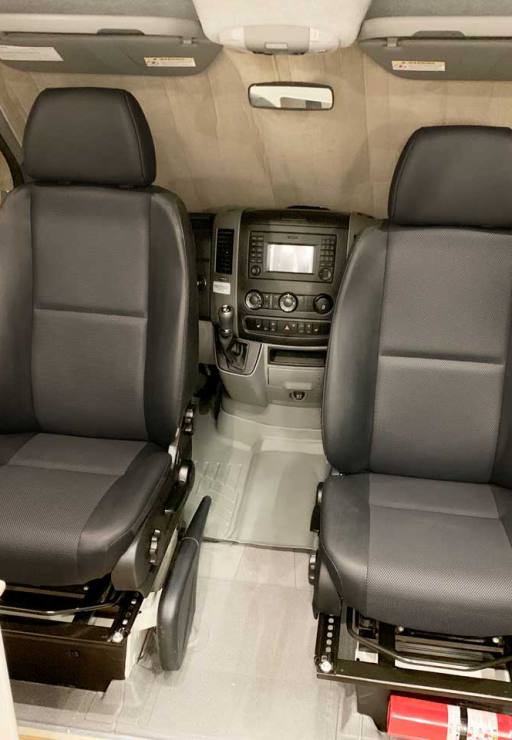 Front seats swivel for facing the interior of the van.