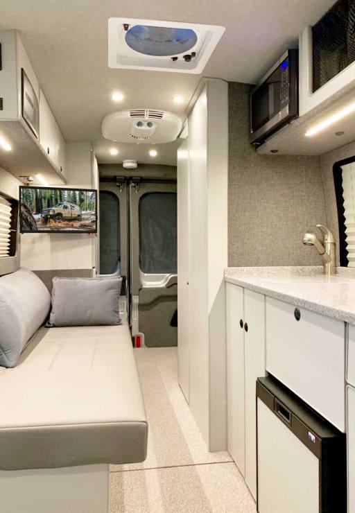 Van conversion with modern interior and amenities.