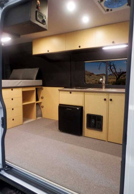 Van conversion with upgraded maple cabinets.