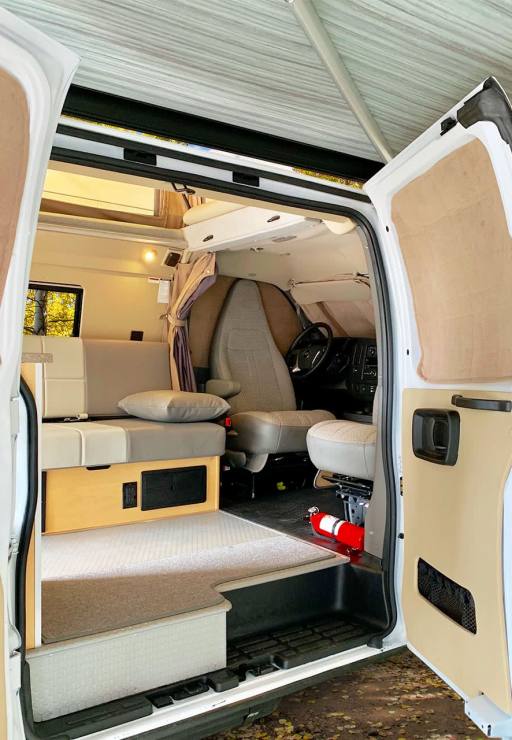 Chevy Express van conversion with awning.