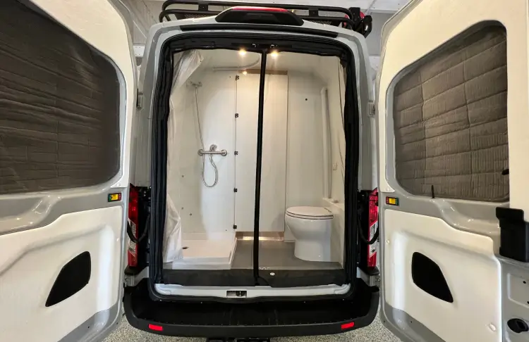 Bathroom installed into the back of the van.