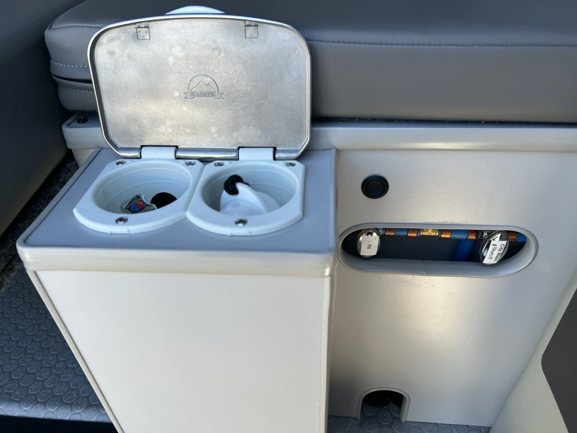 2024 Ford Transit 350 148 High Roof AWD, rear utility cabinet with Scandvik exterior shower mixer and city water fill valves