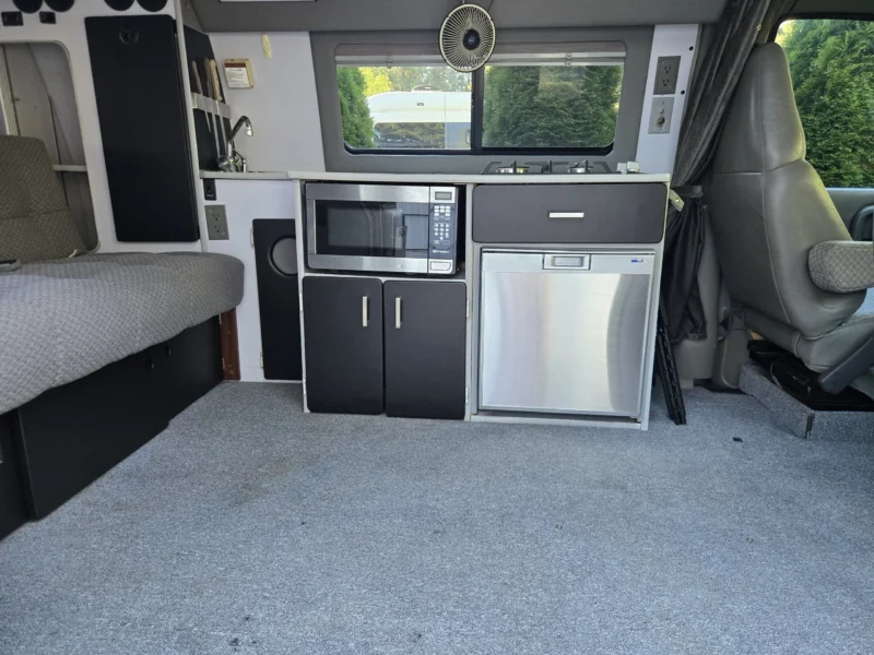 2001 Chevy Express 2500 EB50 Penthouse Top, galley with microwave, fridge and cabinets